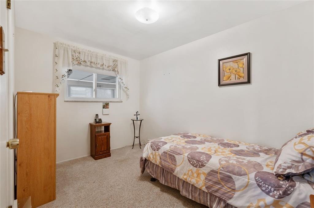 172 Eileen Drive Pittsburgh, PA 15227 - Photo 9 of 21 a bedroom with a bed and painting on the wall