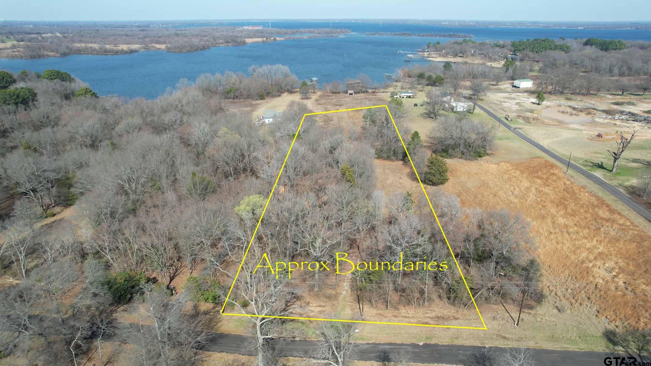 1575 County Road 1575 Alba, TX 75410 - Photo 2 of 15 a view of a lake with beach