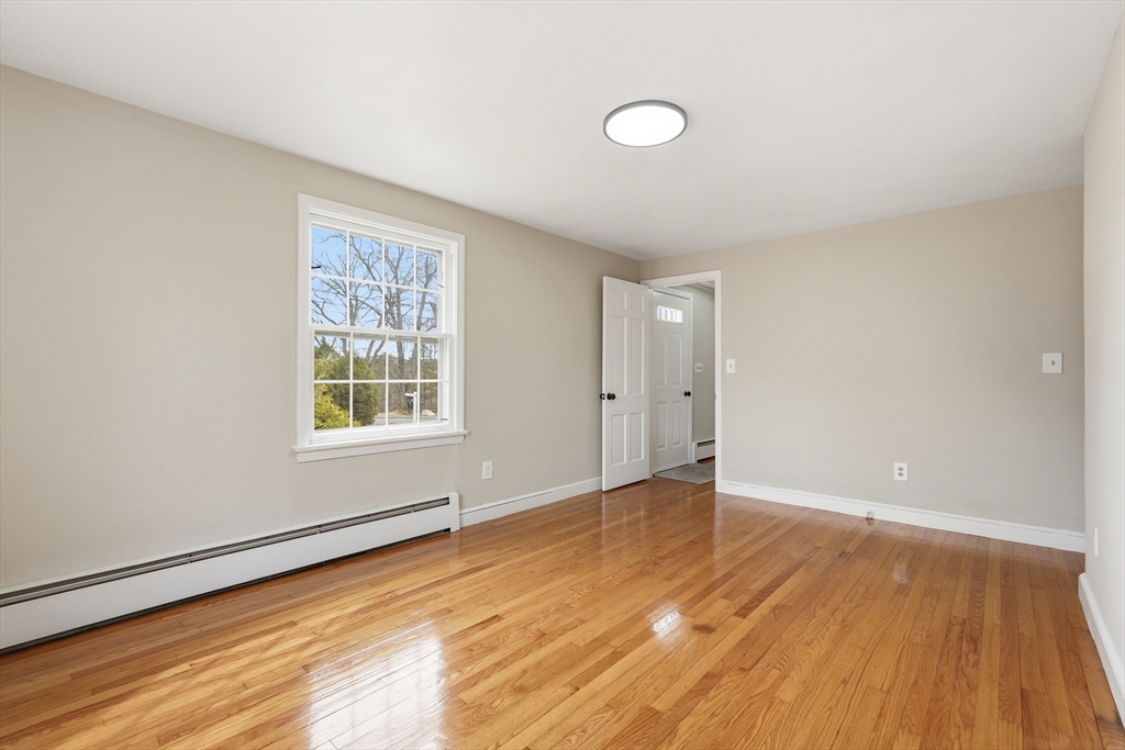 75 North Road Hampden, MA 01036 - Photo 18 of 42 an empty room with wooden floor and windows