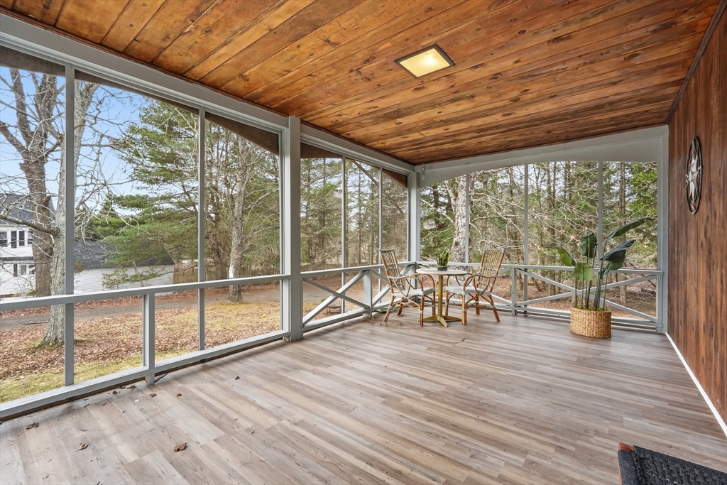 75 North Road Hampden, MA 01036 - Photo 23 of 42 a view of a patio with a table chairs and wooden floor