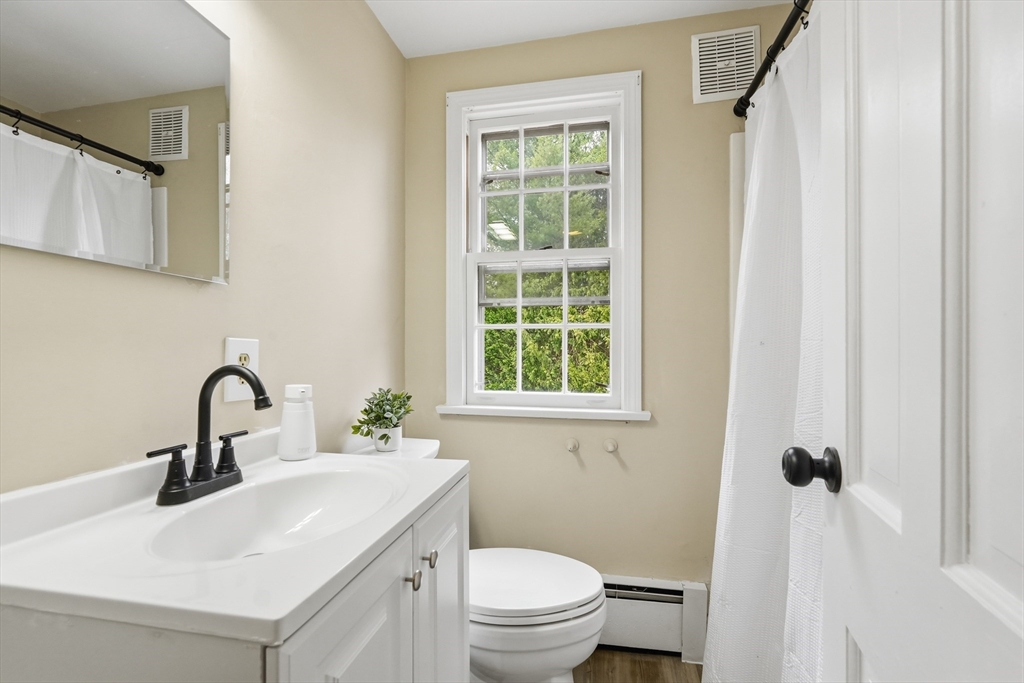 75 North Road Hampden, MA 01036 - Photo 30 of 42 a bathroom with a sink toilet and a mirror