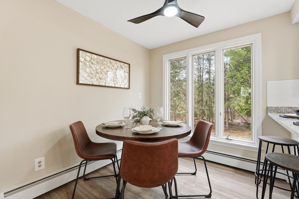 75 North Road Hampden, MA 01036 - Photo 10 of 42 a dining room with furniture a large window and wooden floor