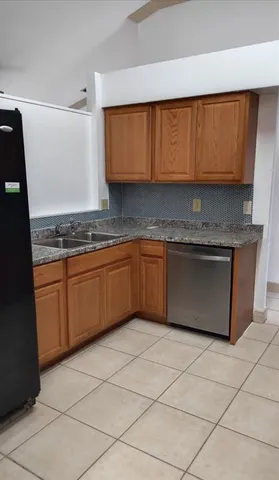 a kitchen with stainless steel appliances granite countertop a stove sink and cabinets