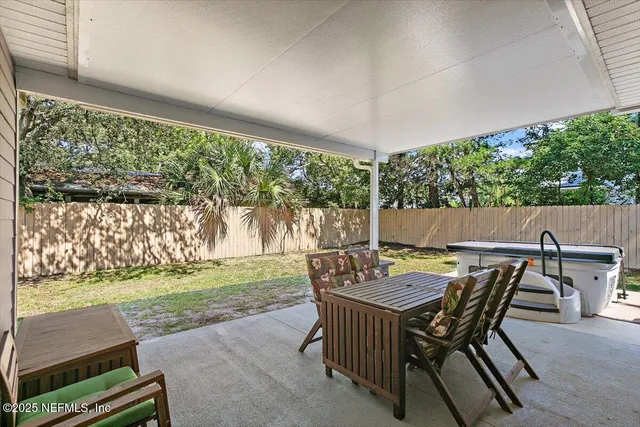 a view of an outdoor sitting area with furniture and garden