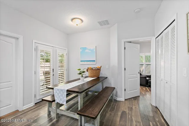 a workspace with wooden floor and furniture