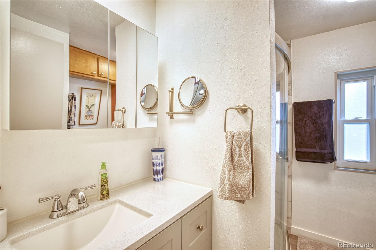 5000 Butte Street Boulder, CO 80301 - Photo 11 of 16 a bathroom with a sink and a mirror