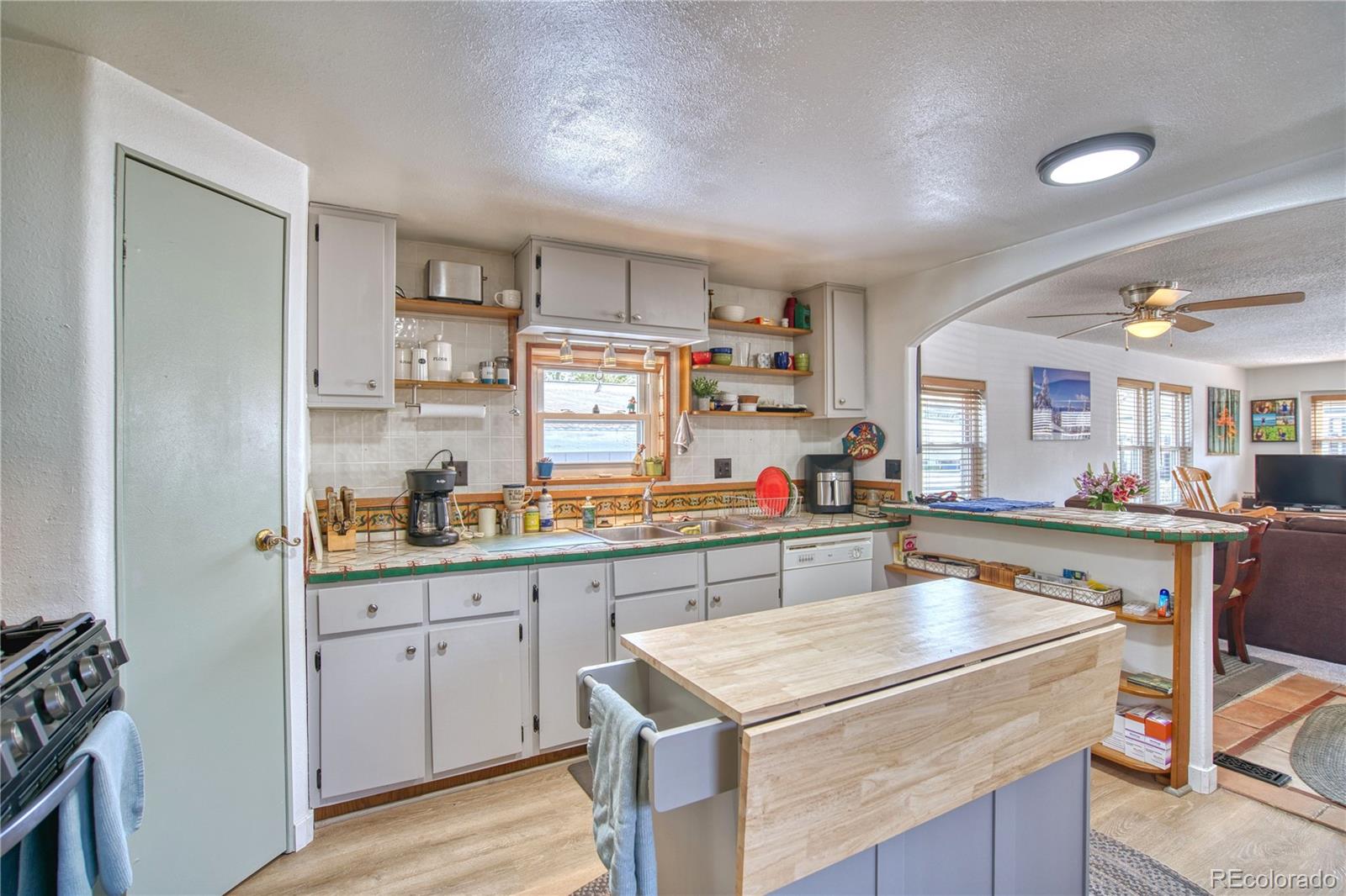 5000 Butte Street Boulder, CO 80301 - Photo 4 of 16 a kitchen that has a sink and a stove in it