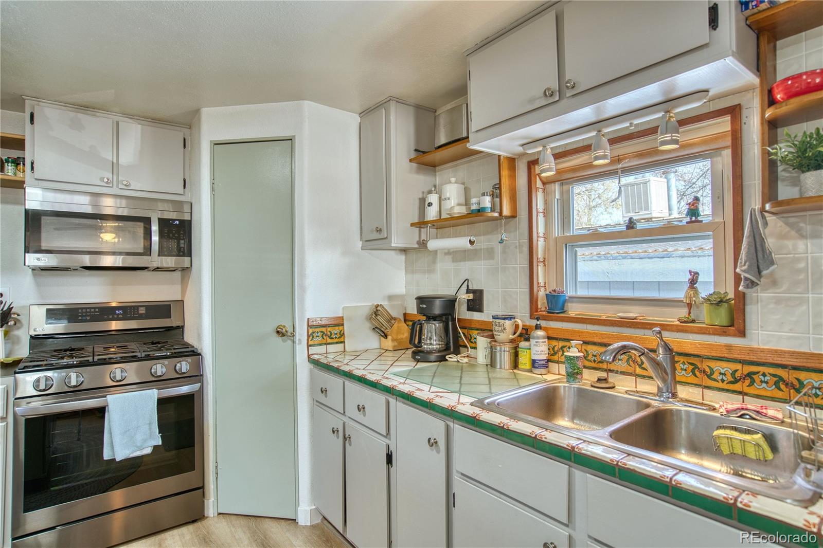 5000 Butte Street Boulder, CO 80301 - Photo 5 of 16 a kitchen with granite countertop a sink stainless steel appliances and cabinets