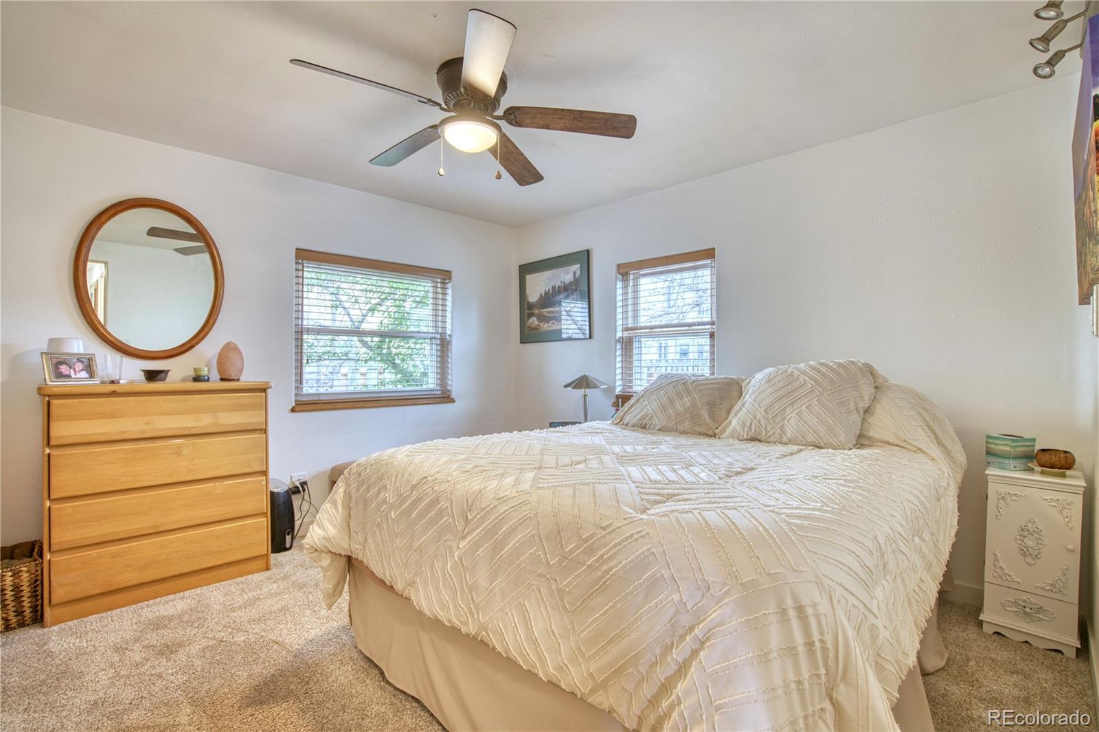 5000 Butte Street Boulder, CO 80301 - Photo 9 of 16 a bedroom with a bed and a chandelier