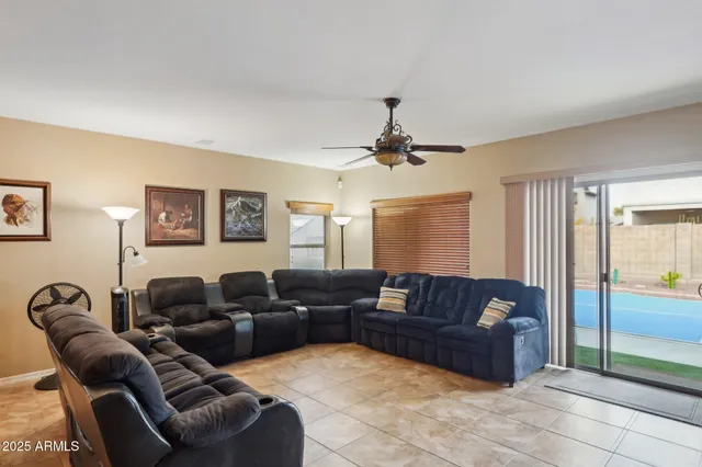a dining room filled a chandelier a glass table and chairs