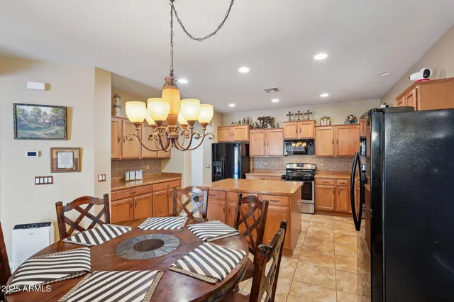 a living room with furniture a rug and a large window