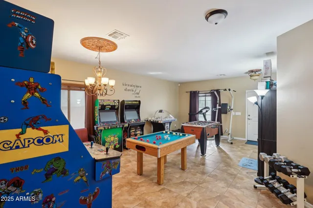 a view of a livingroom with furniture and staircase