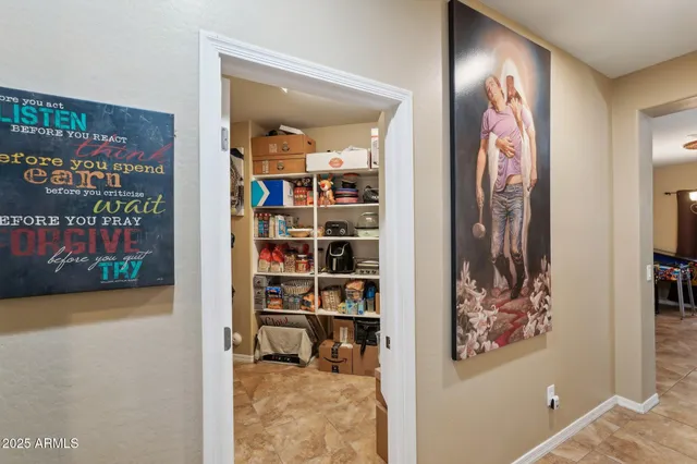 a spacious bathroom with a double vanity sink and a mirror