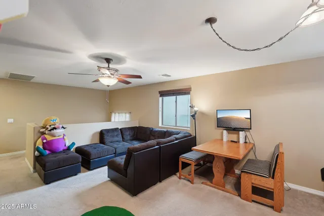a spacious bathroom with a double vanity sink mirror and toilet