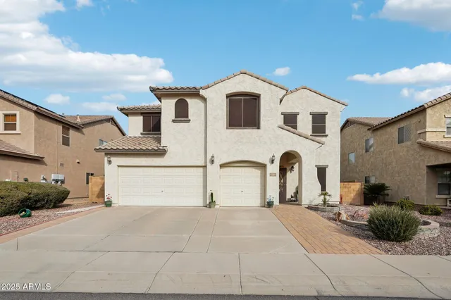 a view of a white house with a outdoor space