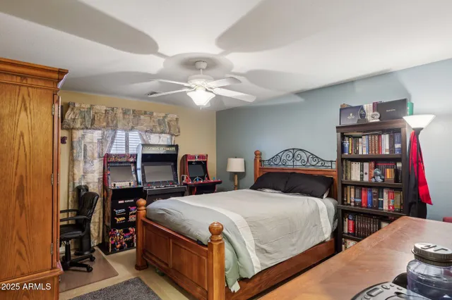 a bedroom with a bed furniture and a window