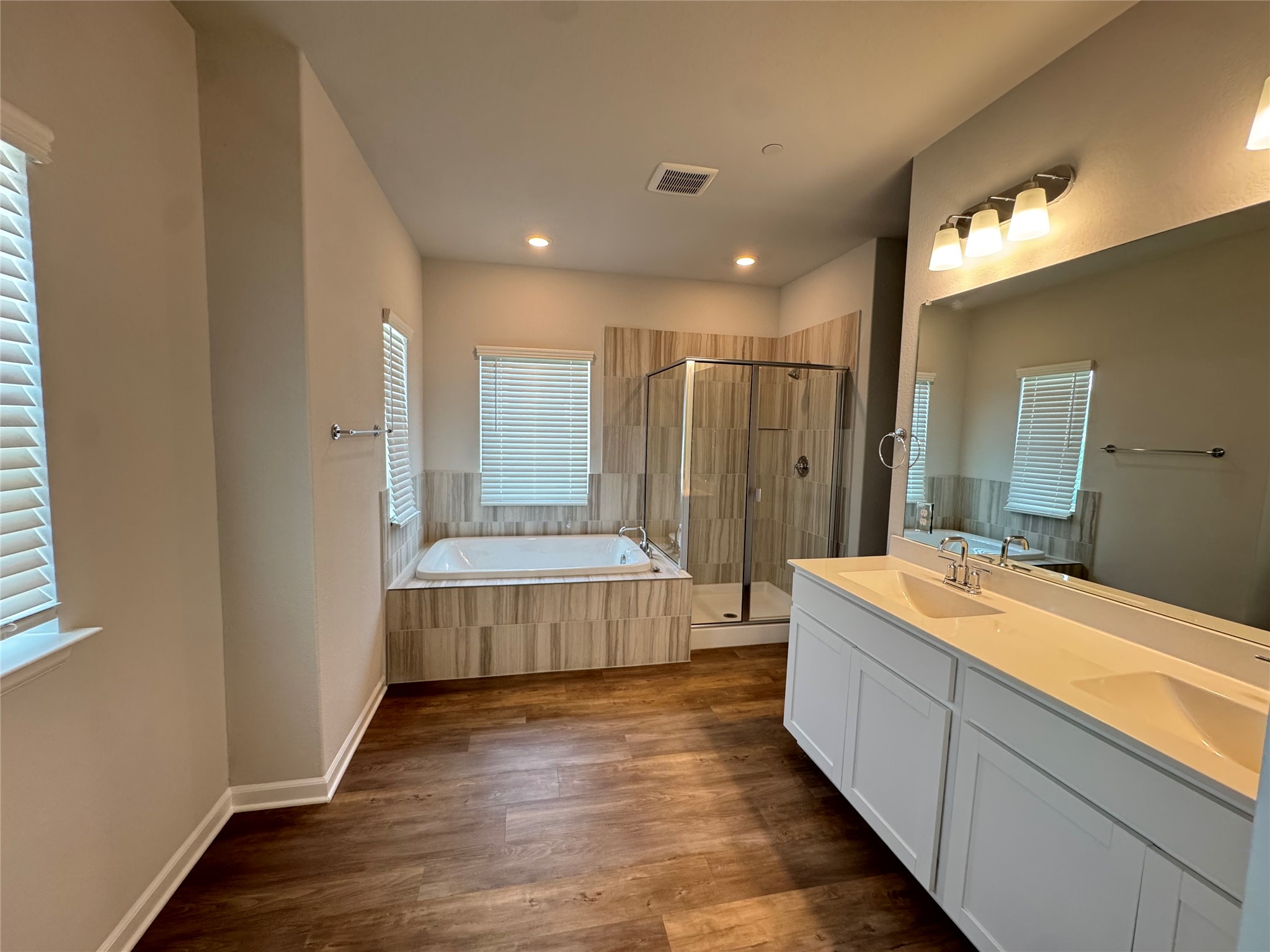 3000 Chisholm Trail Road, Unit 41 Round Rock, TX 78681 - Photo 13 of 28 Indulge in a tranquil primary bath featuring a spacious soaking tub and an oversized walk-in shower.