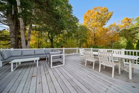 a view of a chairs and table on the wooden floor