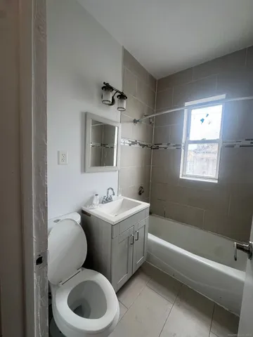 a bathroom with a toilet sink and bathtub
