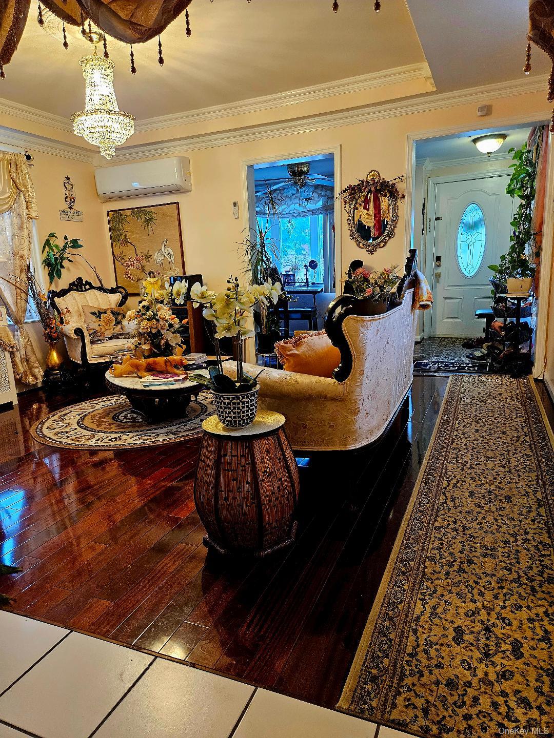 111-31 140th Street Queens, NY 11435 - Photo 12 of 20 a living room with furniture and a window