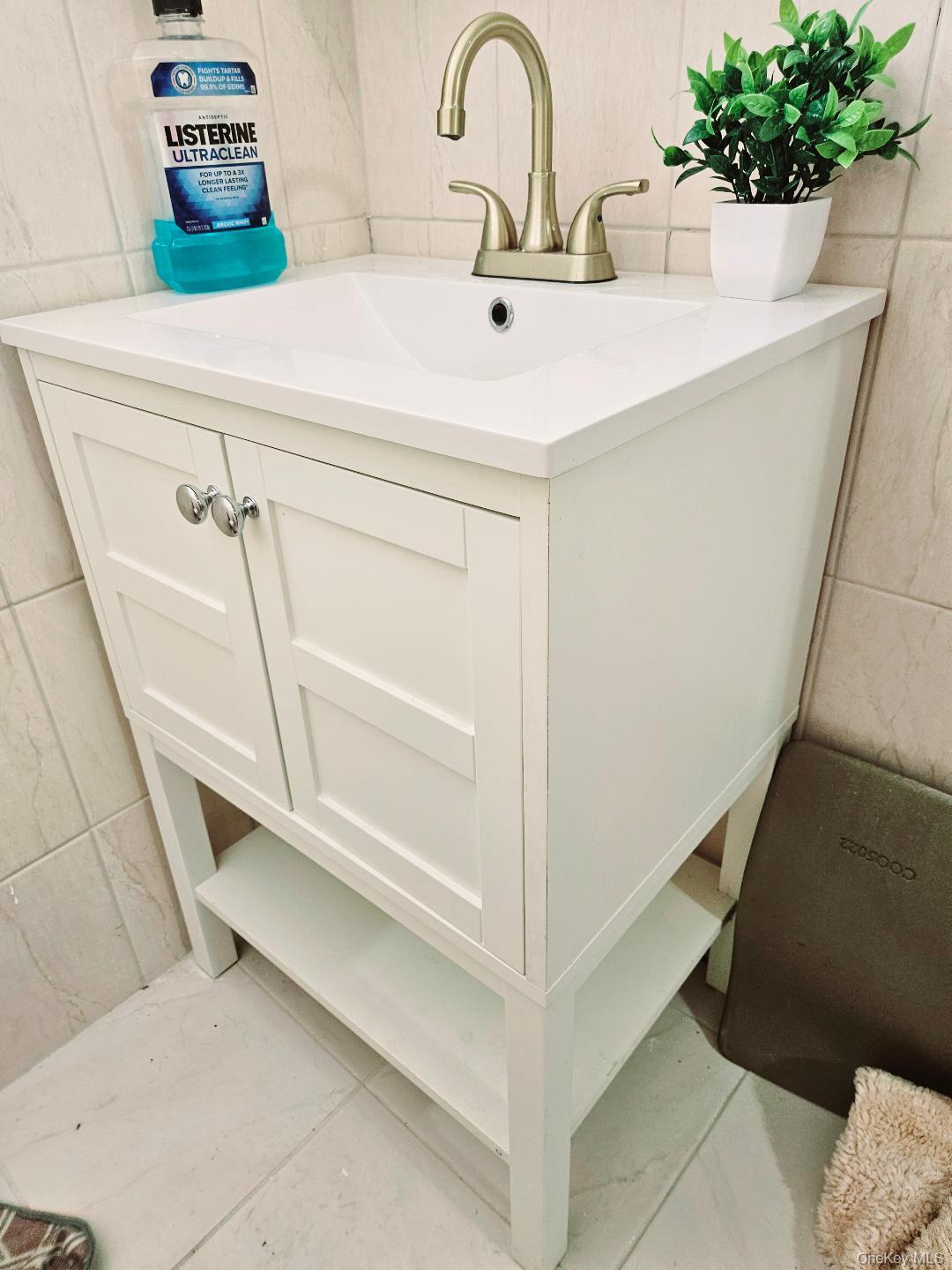 111-31 140th Street Queens, NY 11435 - Photo 13 of 20 a close view of sink and tap