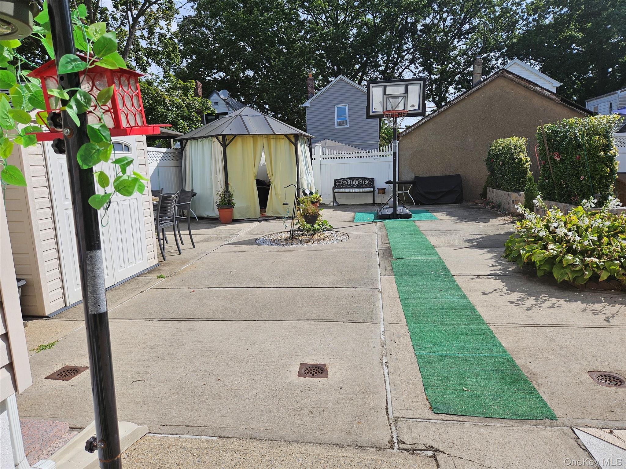 111-31 140th Street Queens, NY 11435 - Photo 17 of 20 a view of house with garden