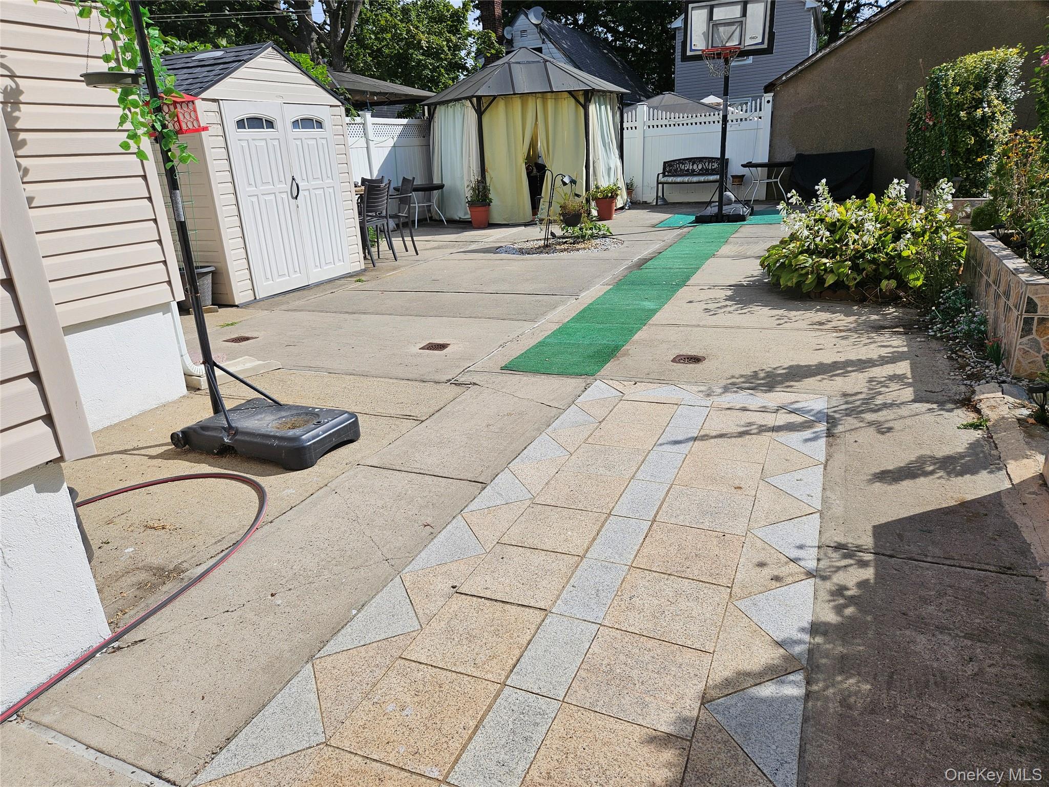 111-31 140th Street Queens, NY 11435 - Photo 19 of 20 a view of a backyard with sitting area