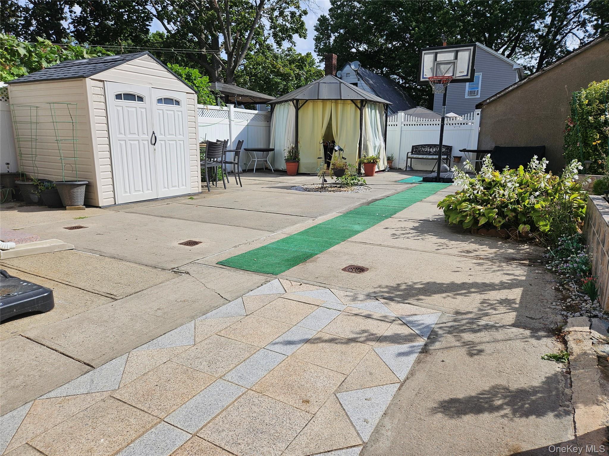 111-31 140th Street Queens, NY 11435 - Photo 20 of 20 a front view of a house with garden