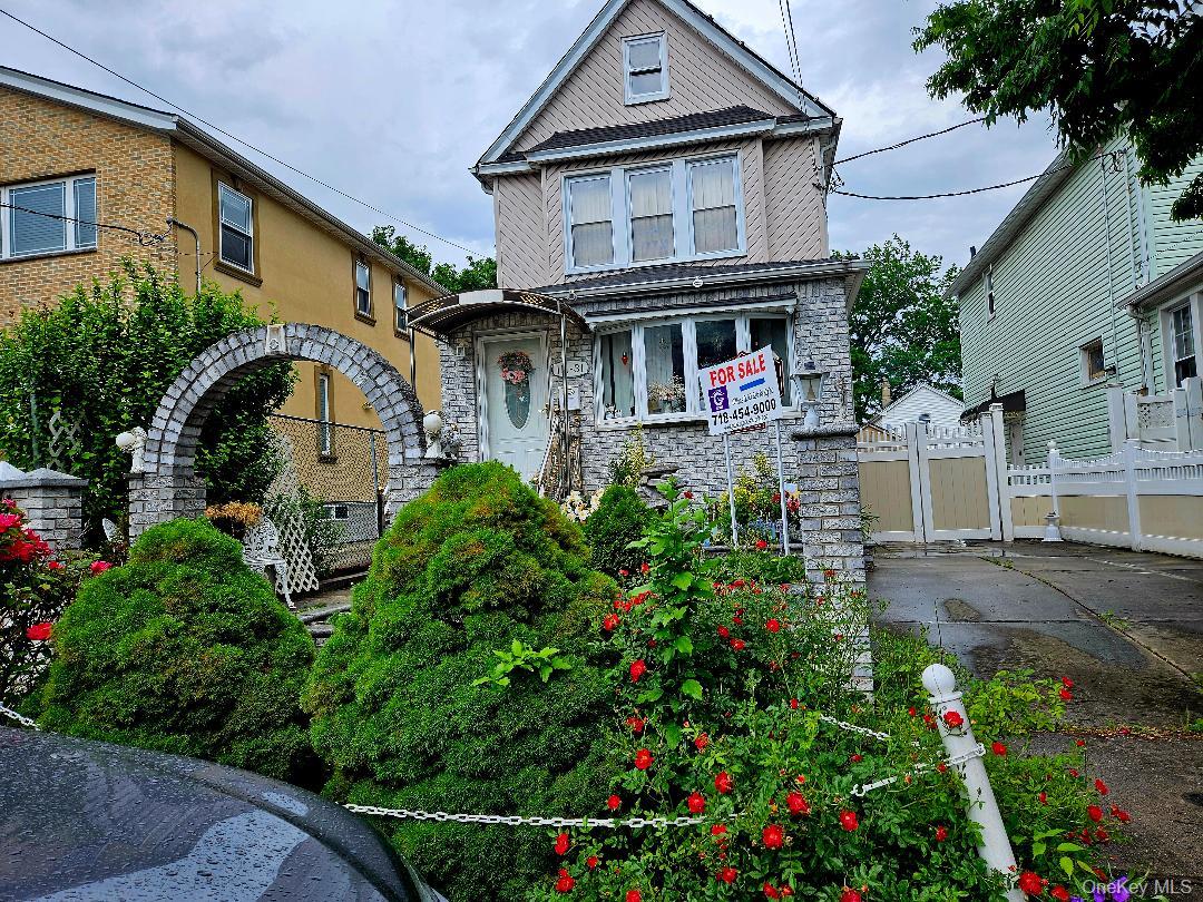 111-31 140th Street Queens, NY 11435 - Photo 3 of 20 a front view of a house with a yard