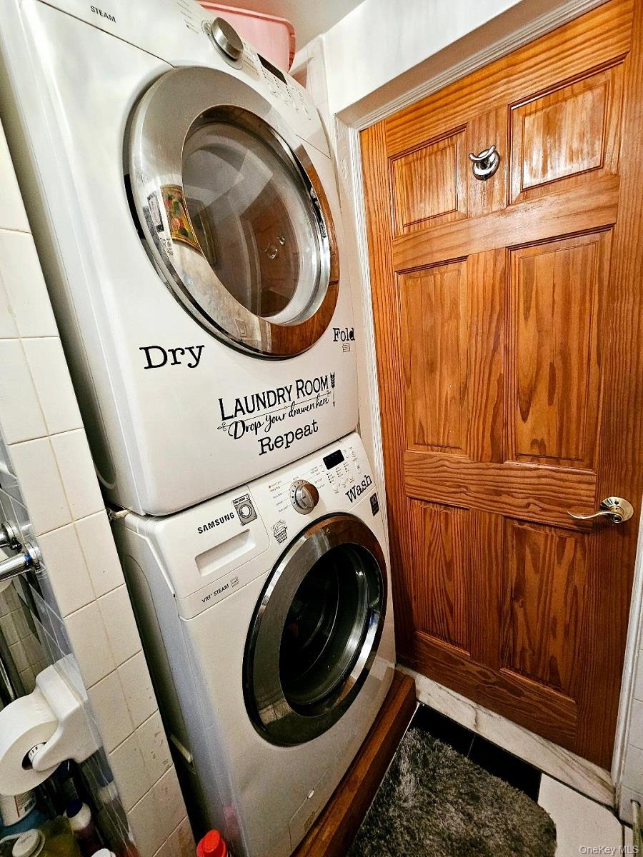 111-31 140th Street Queens, NY 11435 - Photo 10 of 20 a utility room with dryer and washer