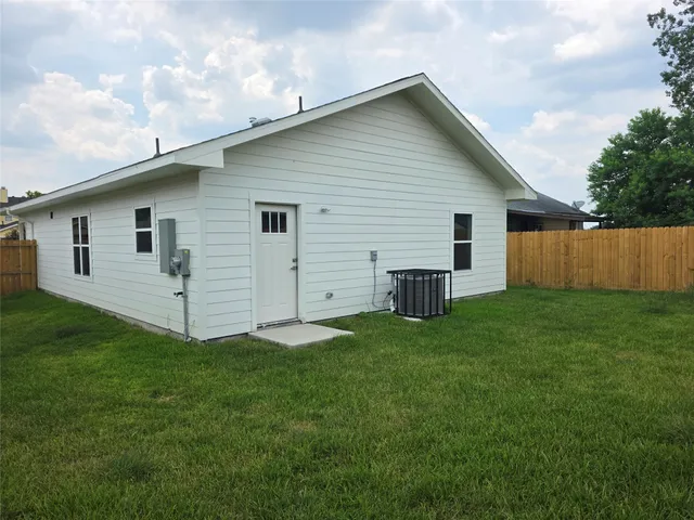 a view of a backyard with plants and a backyard
