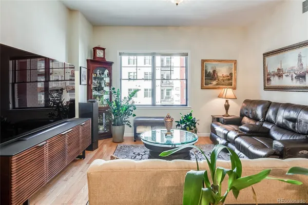 a kitchen with kitchen island granite countertop a stove top oven a sink a counter space and cabinets