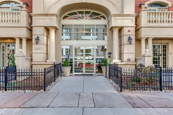 a view of a tall building next to a road