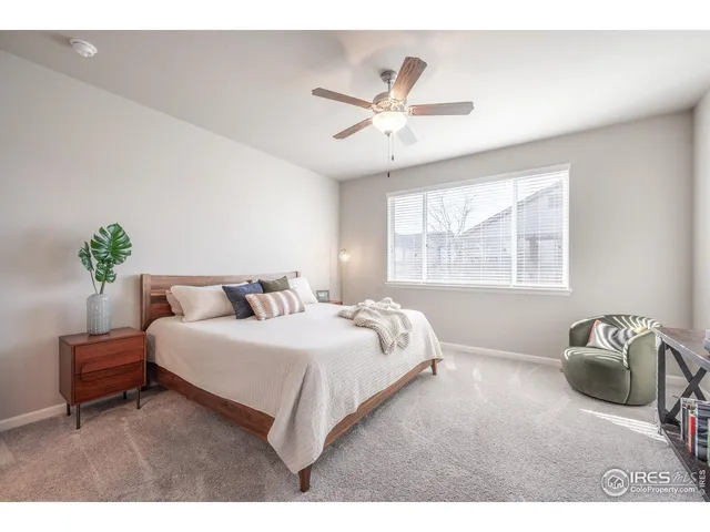 a bedroom with a bed and window