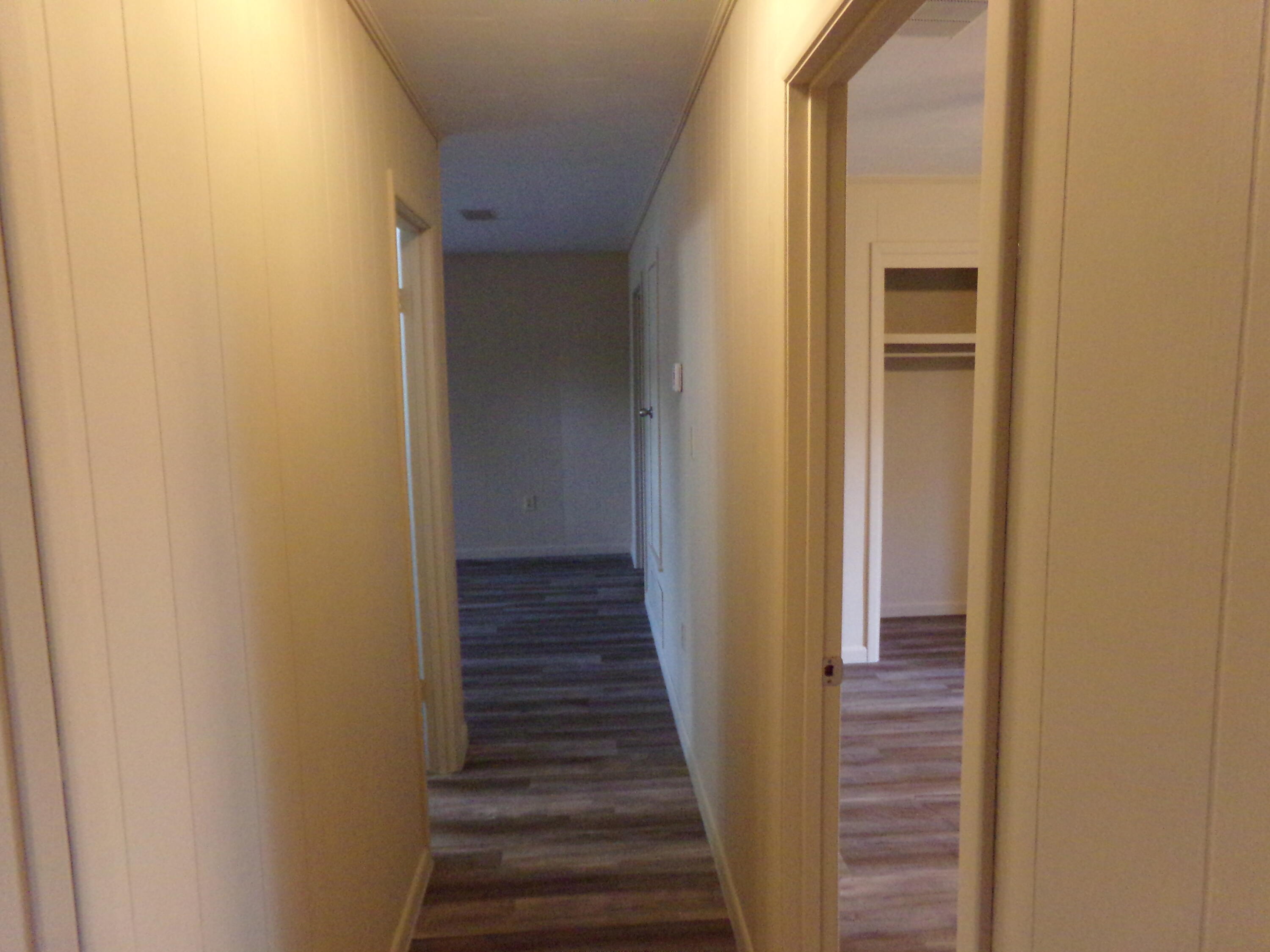 4071 Painter Branch Road Crestview, FL 32539 - Photo 15 of 64 a view of a hallway with wooden floor and entryway
