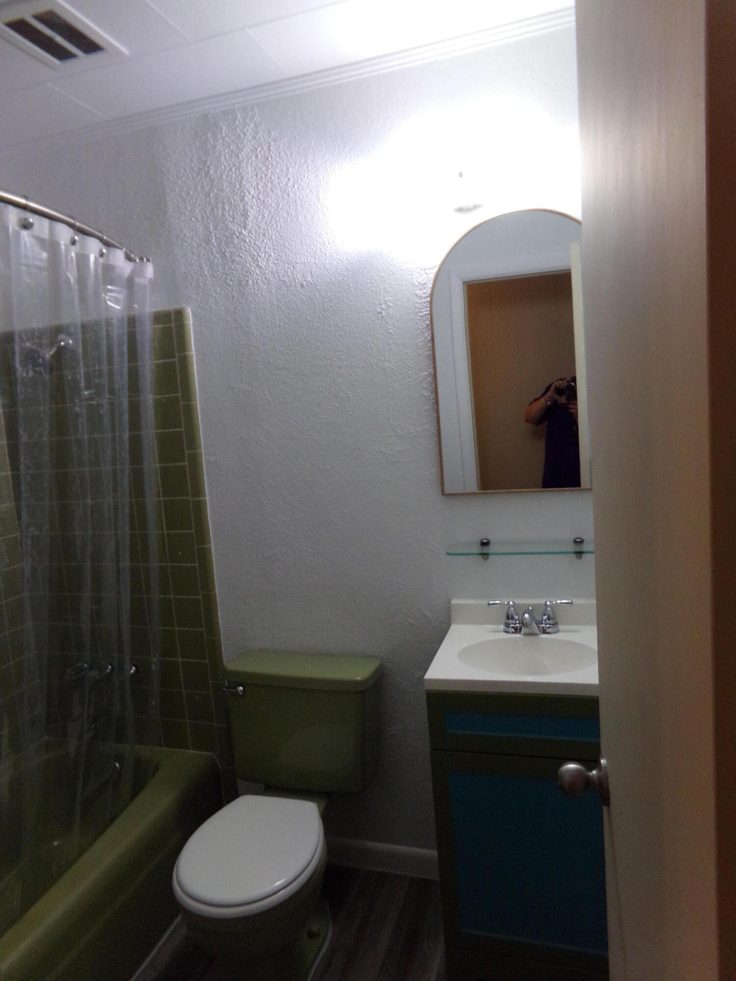 4071 Painter Branch Road Crestview, FL 32539 - Photo 21 of 64 a bathroom with a toilet sink and mirror