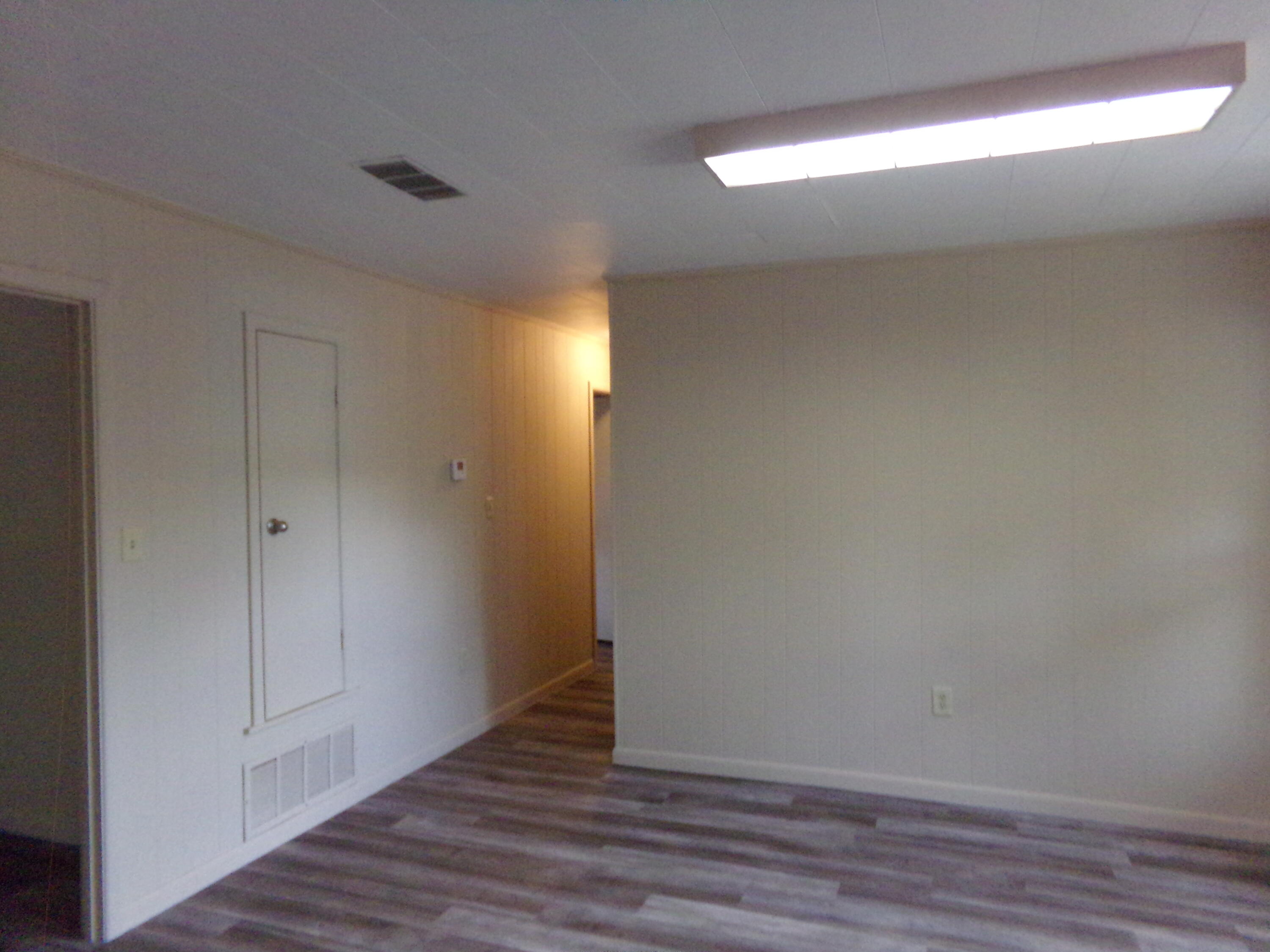 4071 Painter Branch Road Crestview, FL 32539 - Photo 26 of 64 a view of an empty room with wooden floor