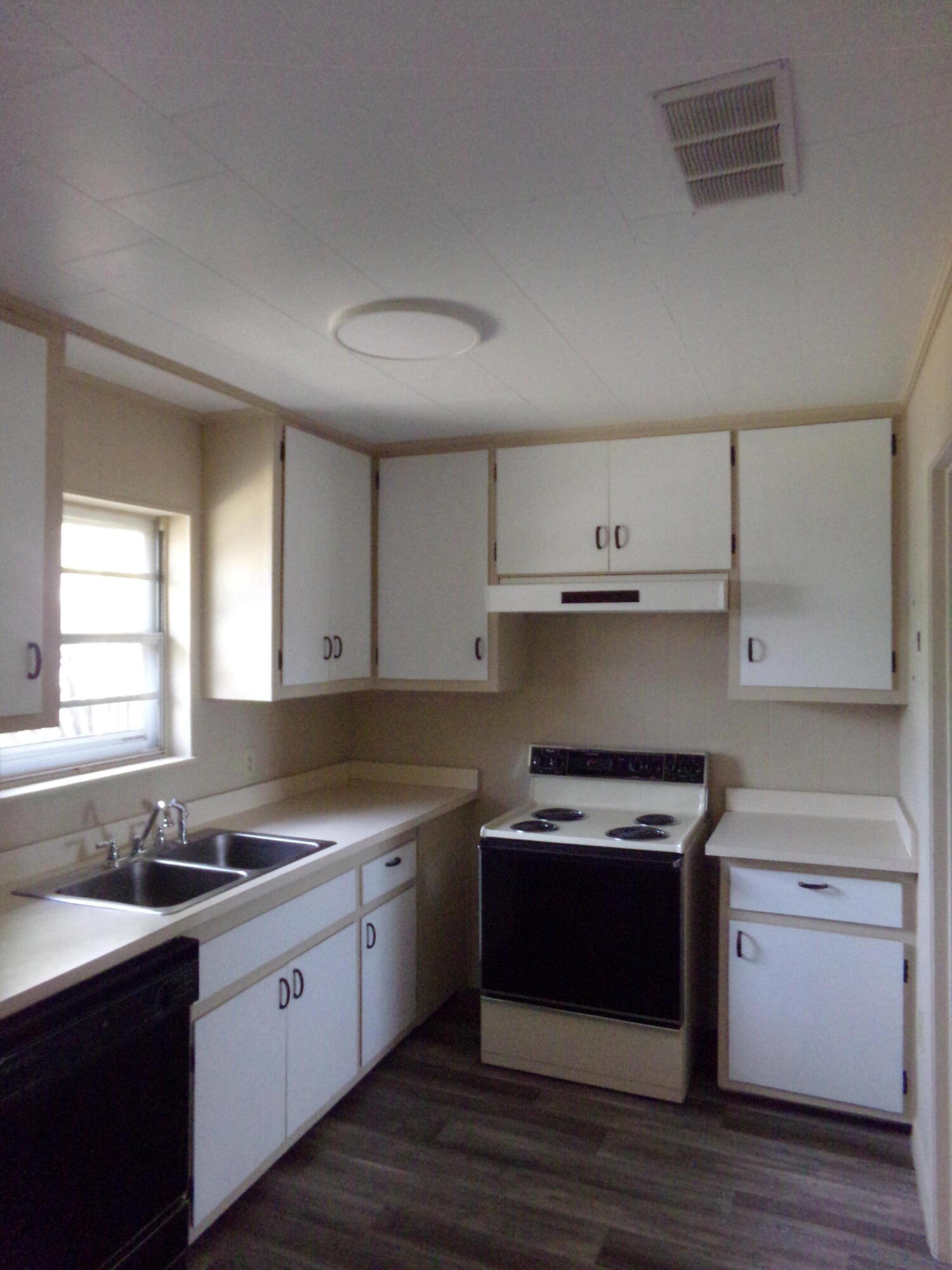 4071 Painter Branch Road Crestview, FL 32539 - Photo 28 of 64 a kitchen with a sink stove top oven and cabinets