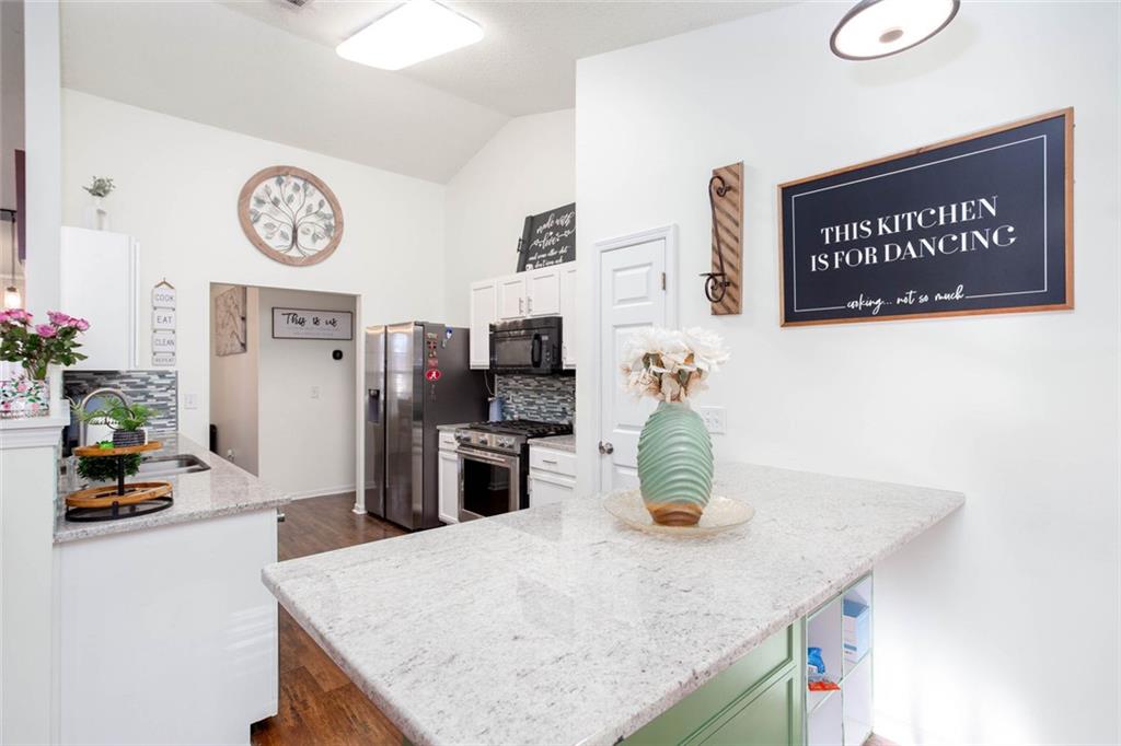 31 Abbey Lane Cartersville, GA 30120 - Photo 12 of 34 a kitchen with a table and chairs
