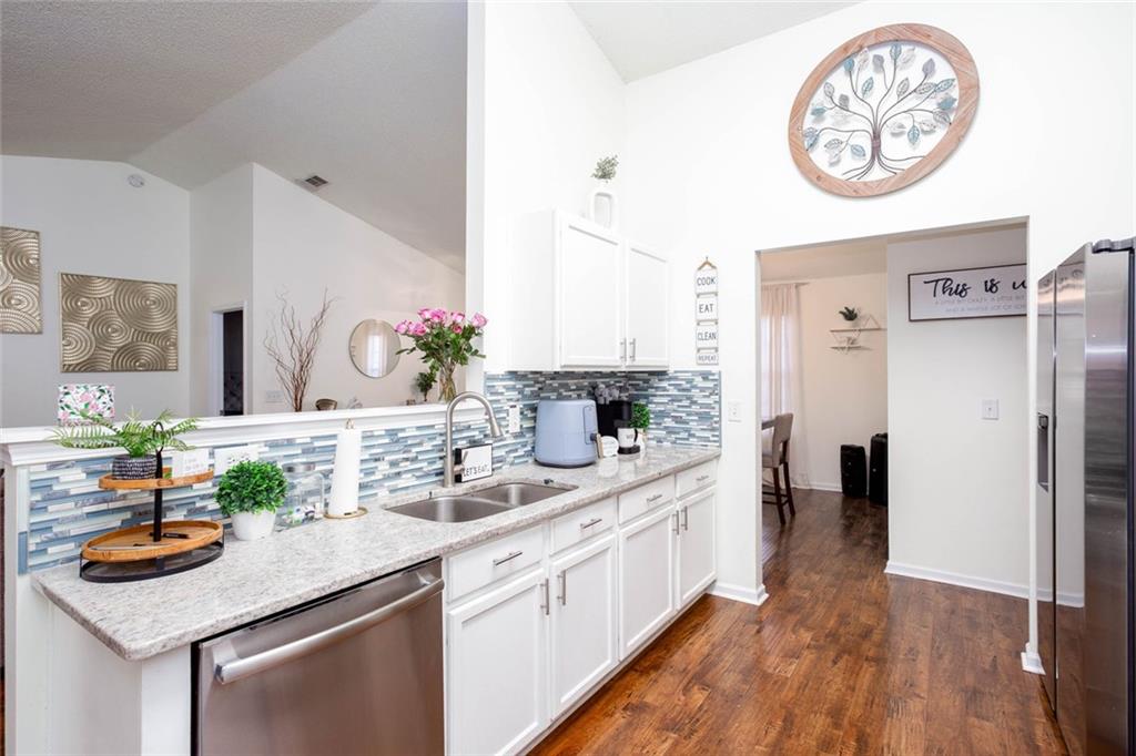 31 Abbey Lane Cartersville, GA 30120 - Photo 13 of 34 a kitchen with stainless steel appliances granite countertop a sink and a stove