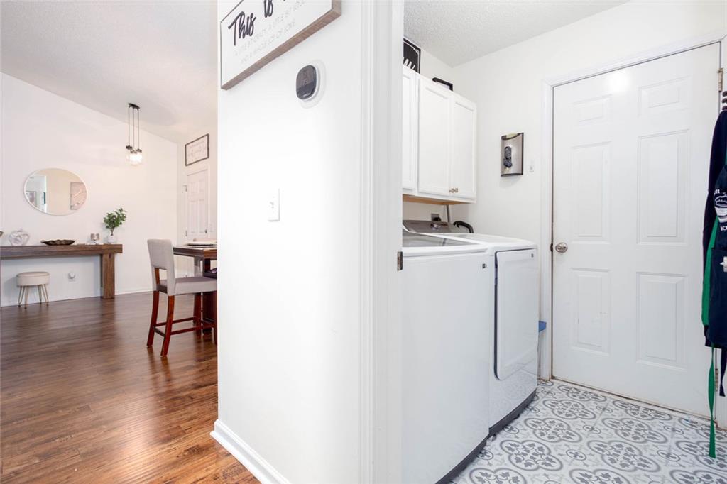 31 Abbey Lane Cartersville, GA 30120 - Photo 16 of 34 a bathroom with a sink a mirror and a shower
