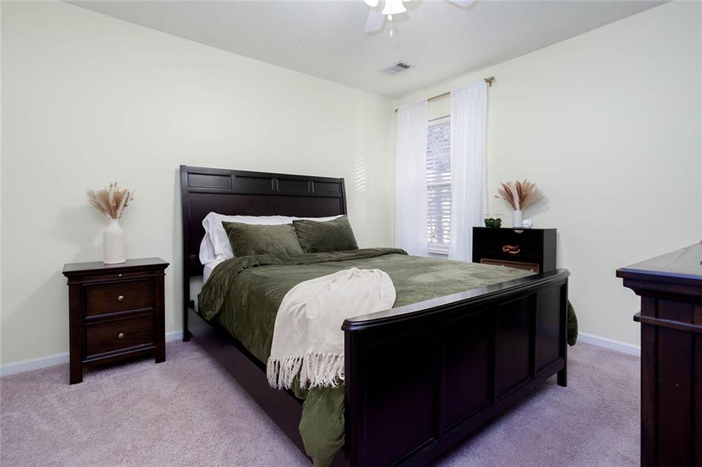 31 Abbey Lane Cartersville, GA 30120 - Photo 17 of 34 a bedroom with a bed and a dresser