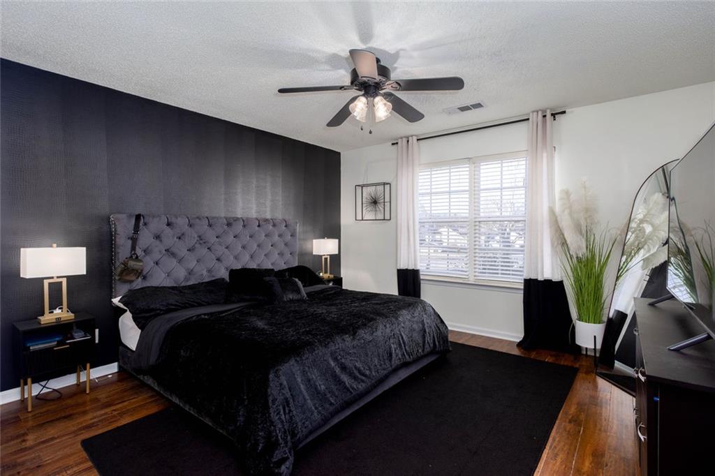 31 Abbey Lane Cartersville, GA 30120 - Photo 21 of 34 a bedroom with bed mirror and window