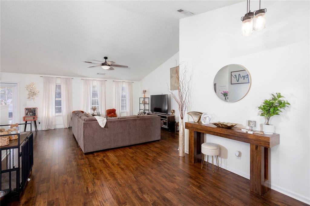 31 Abbey Lane Cartersville, GA 30120 - Photo 7 of 34 a living room with furniture and a wooden floor