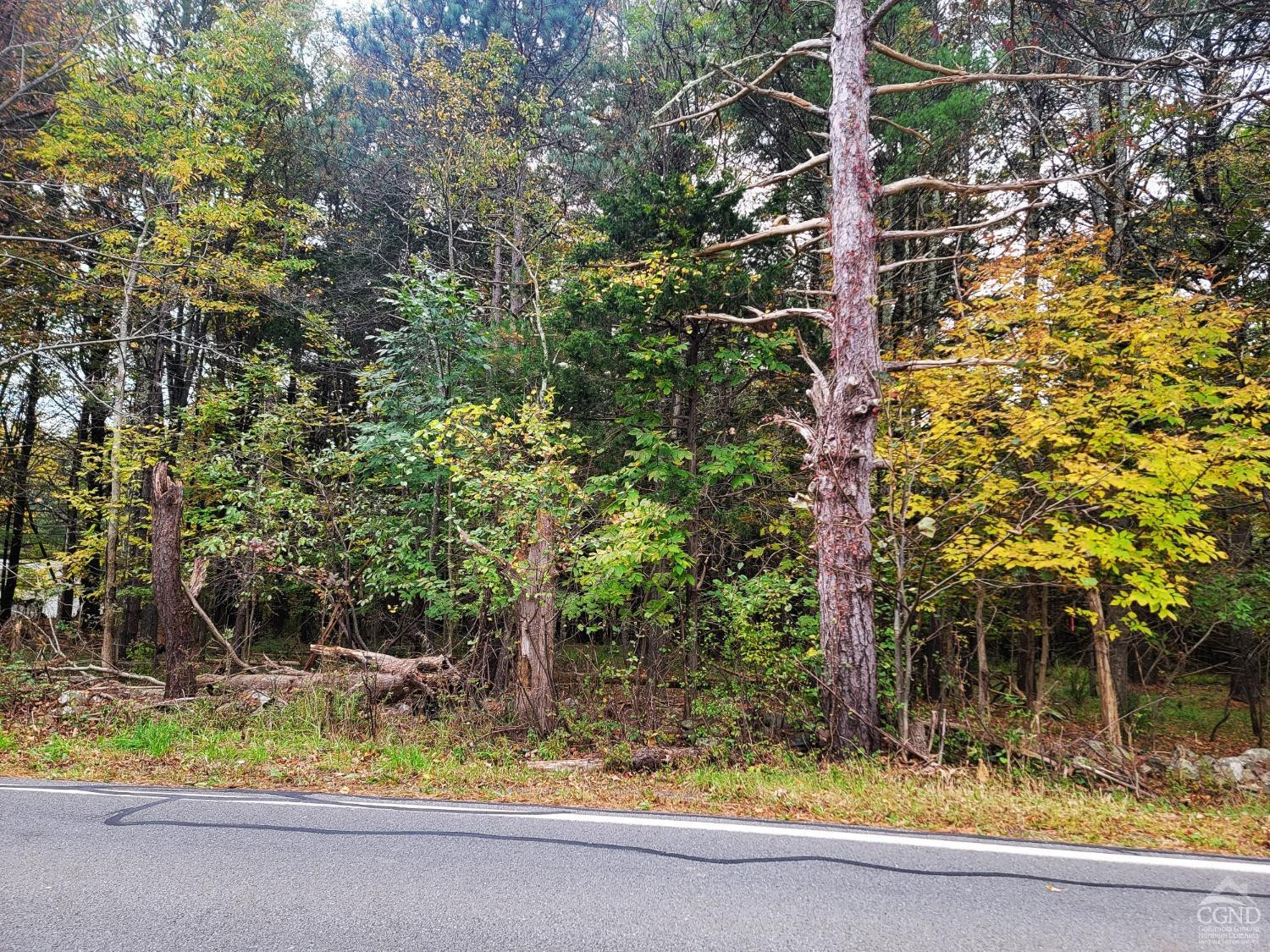 a view of swimming pool with a yard and sitting area