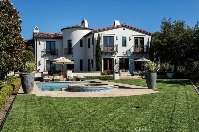 a front view of a house with swimming pool