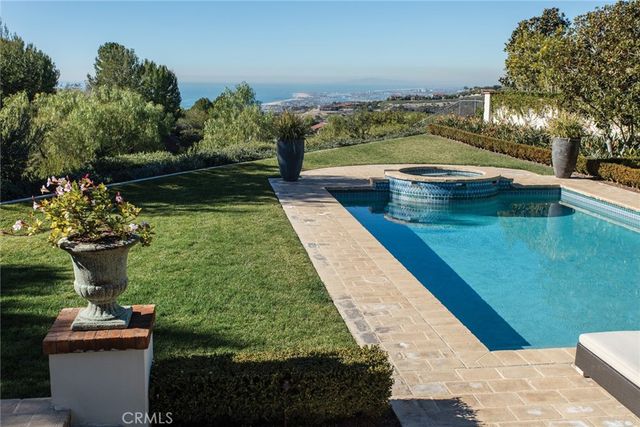 a view of swimming pool with a patio