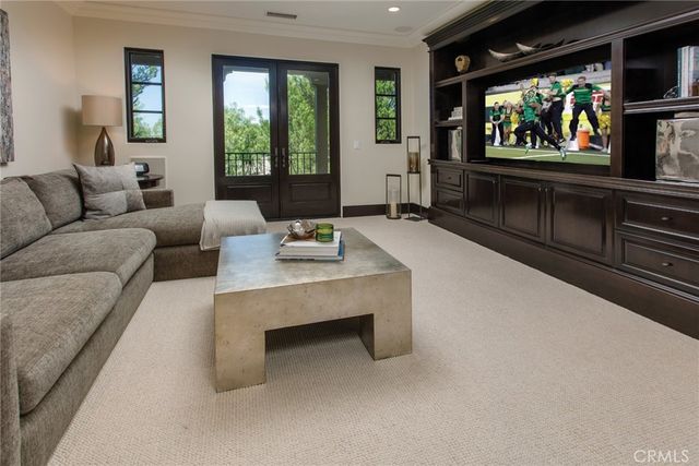 a bedroom with a bed lamp and window
