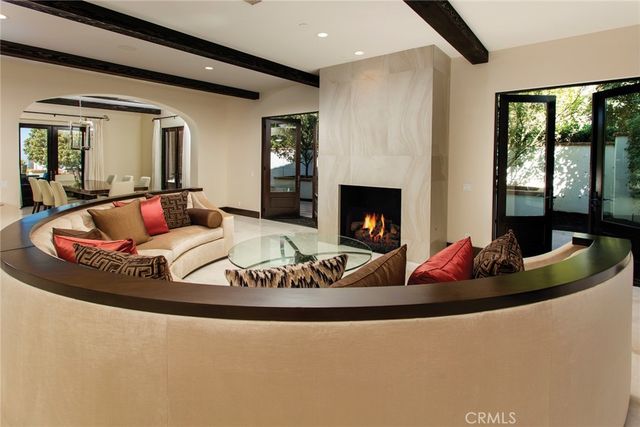 a living room with furniture fireplace and flat screen tv