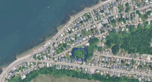 a view of balcony with wooden floor